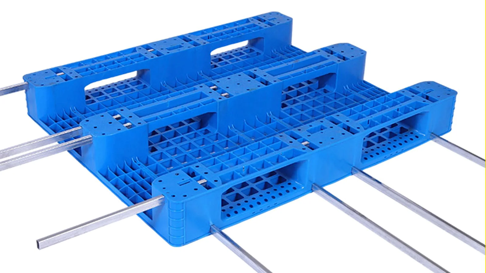 Blue plastic pallets being reviewed for material and sourcing documentation