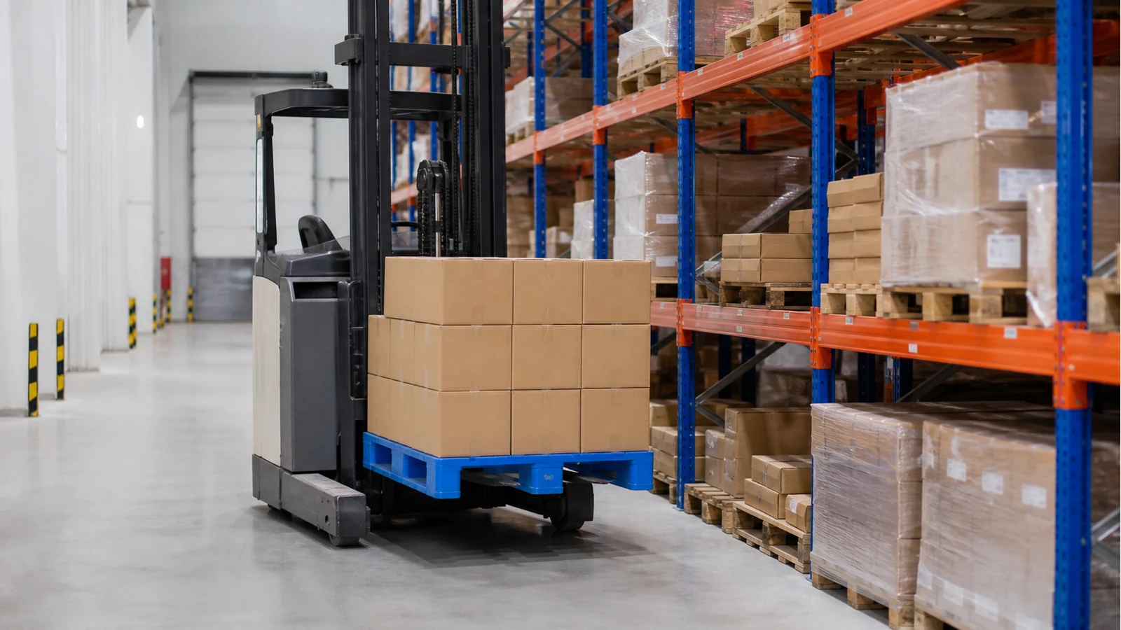 Blue plastic pallet with boxed load approaching warehouse racking on a reach truck