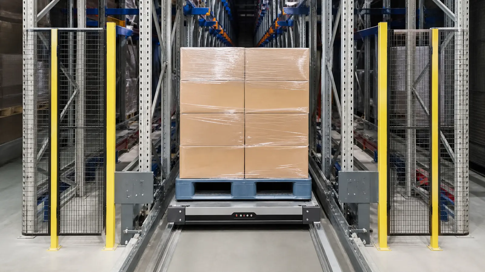 A blue plastic pallet carrying a wrapped carton load at an automated pallet-shuttle lane entrance
